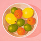 contemporary modern original oil painting of colourful lemons, mandarines and lime fruits in a bowl on a soft pink background