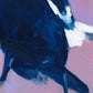 closeup of an original oil painting of a magpie in navy and white on a smooth and textured lilac background