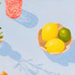 contemporary modern original oil painting of colourful fruits and flowers on a soft sky blue background