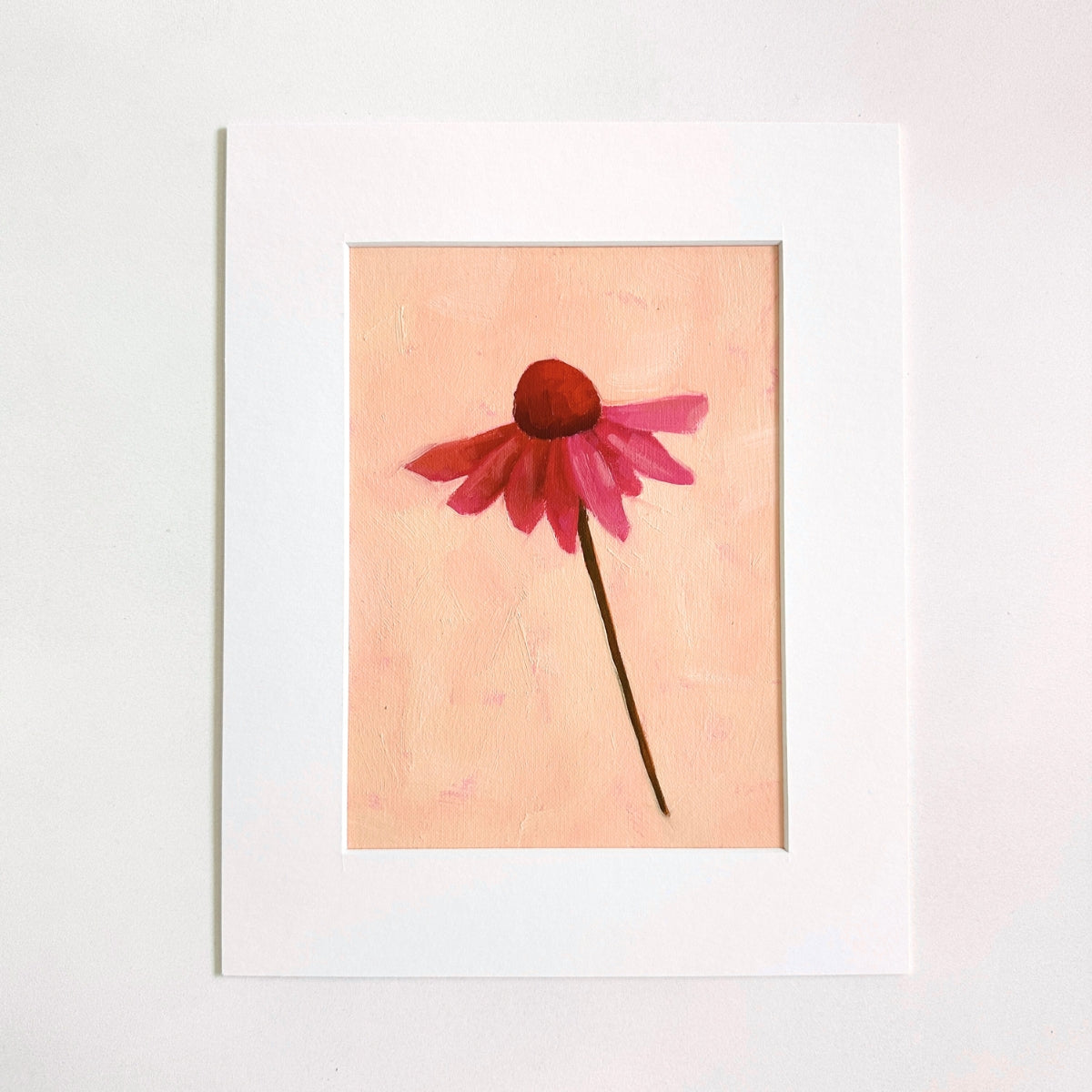 original oil painting of an echinacea flower with pink petals in a textured peachy background