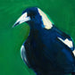 closeup of an original oil painting of a navy blue magpie on an emerald green background