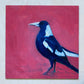 oil painting on panel of a magpie in navy blue and white on a bright pink background