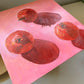 an image of an original oil painting on wooden panel of three red pomegranates on a bright pink background