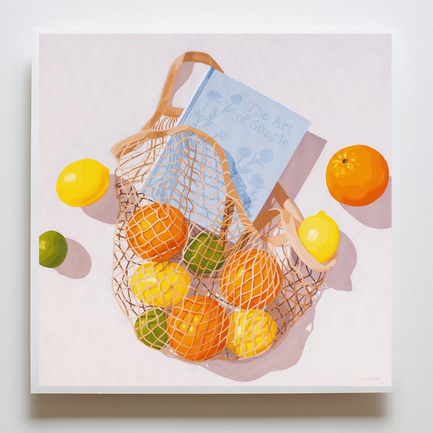 modern and contemporary fine art paper print of an original oil painting of colorful citrus fruits like lemons, orange and limes, in a string/net bag with a light blue diary reading the art of simple. The fruits, bag and diary are on a white background with strong shadows